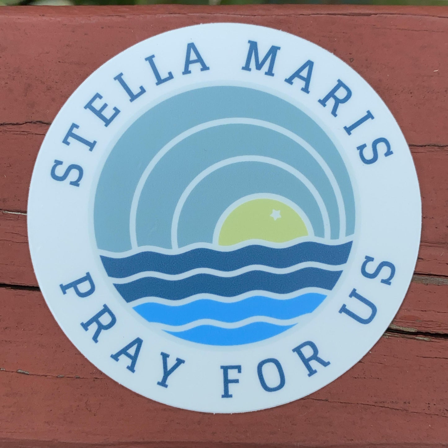 Stella Maris Pray for Us Sky Sun Sea Circle Sticker 3 x 3 against red backdrop