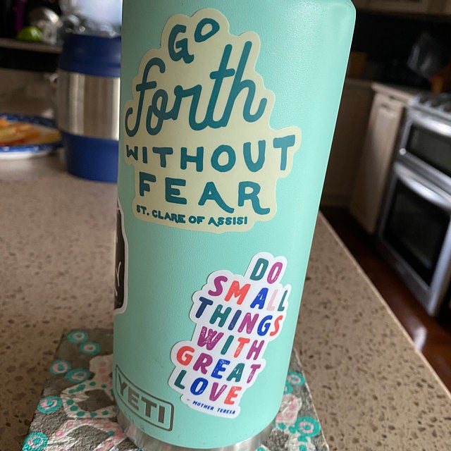 Go Forth Without Fear St Clare of Assisi Sticker on seafoam yeti water bottle