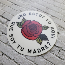 Load image into Gallery viewer, Our Lady of Guadalupe ¿No Estoy Yo Aqui Que Soy Tu Madre? 3x3 Sticker side view shot on white bricks
